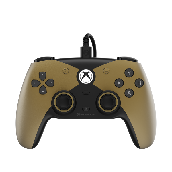 A wired Xbox controller in matte gold and black, featuring the Xbox logo on the center, with the text 'THE COMPETITOR' and 'WIRED CONTROLLER' below on a white background.