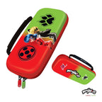 A Miraculous Ladybug hard-shell zippered car case shown in two views: a larger upright view featuring Ladybug and Cat Noir artwork on a red and green gradient background, and a smaller horizontal view showing the handle and the Miraculous logo. The case has a black carrying strap and zipper pulls.