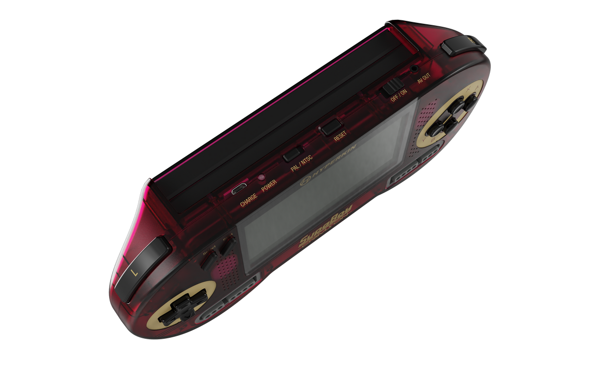 A translucent dark red handheld gaming console with gold accents and a black screen, shown at an angle on a plain white background.
