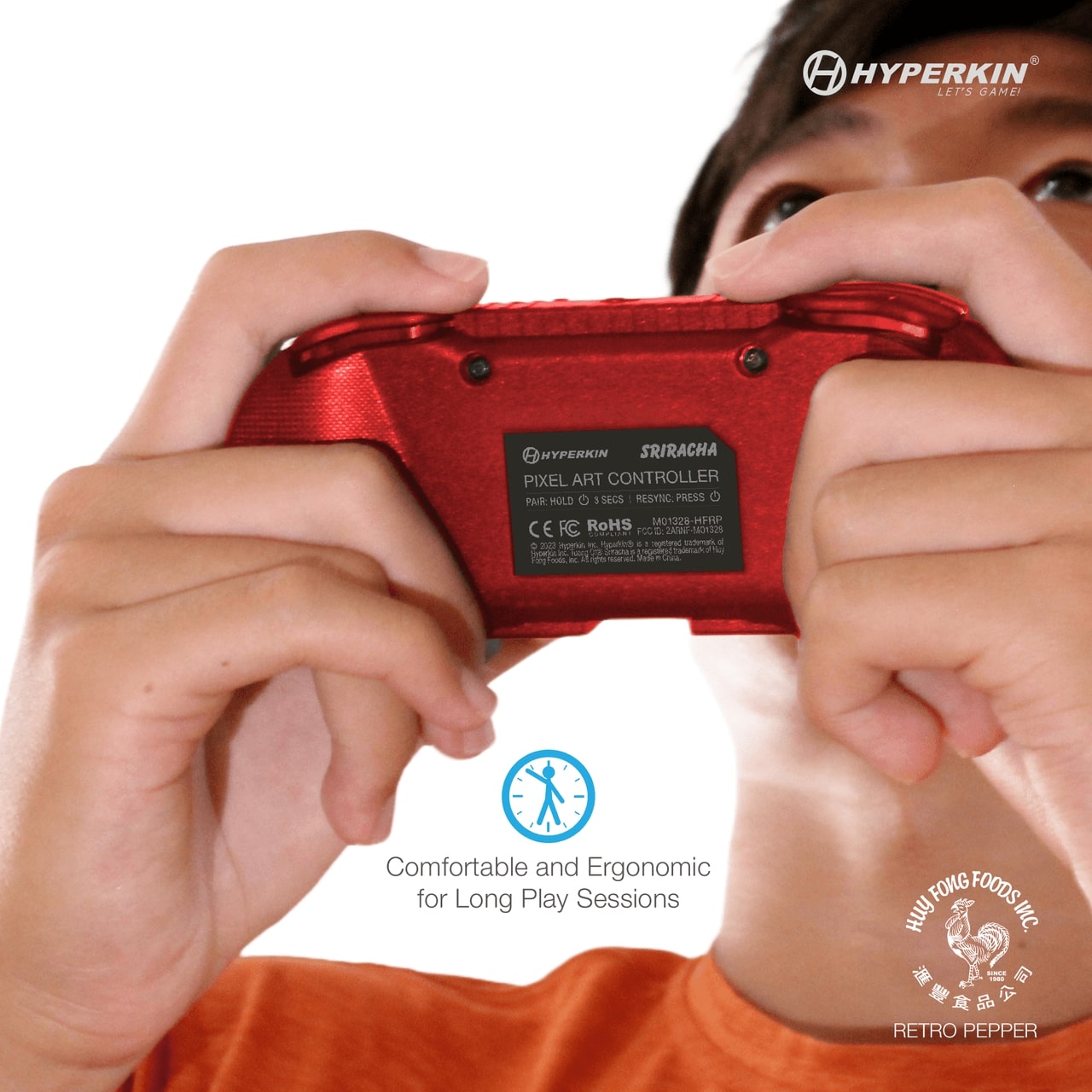 Red Hyperkin Sriracha Pixel Art Bluetooth controller held close to face, showing back label with certifications and model info. Features Hyperkin and Huy Fong Foods logos with text highlighting ergonomic comfort for extended gaming sessions.