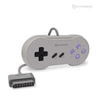 The image shows a Hyperkin game controller designed in a retro style reminiscent of the Super Nintendo Entertainment System (SNES) controller. It has a gray body with purple buttons. The left side features a black directional pad (D-pad), while the right side has four purple action buttons labeled X, Y, B, and A. In the center are two small black buttons labeled 'SELECT' and 'START.' The controller is connected to a cable that ends in an 8-pin connector plug. 
