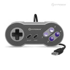 A gray Hyperkin 'Scout' Premium SNES®-Style USB Controller with a wired connection and purple buttons.
