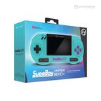 Box for the SupaBoy Hyper Beach console by Hyperkin, featuring a turquoise device with pink buttons and controller ports, set against a blue gradient background with branding and product details.
