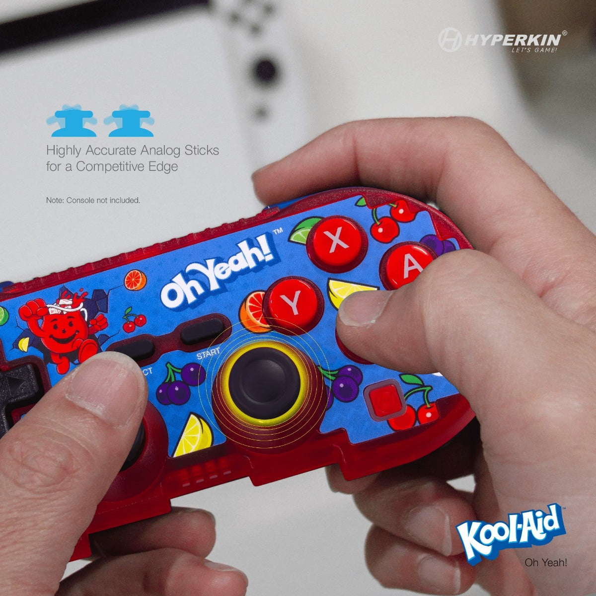 Person holding Kool-Aid themed Hyperkin Pixel Art controller with colorful fruit graphics, labeled buttons, and analog sticks for competitive gaming.